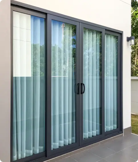 Aluminium sliding doors opening to an outdoor deck