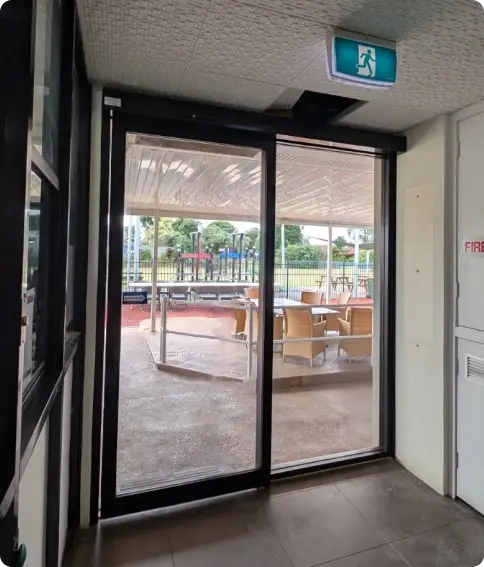 Commercial automatic sliding doors at a shop entrance