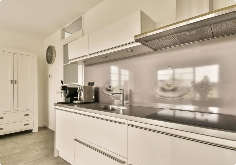Finished kitchen enhanced with a stylish easy-clean glass splashback