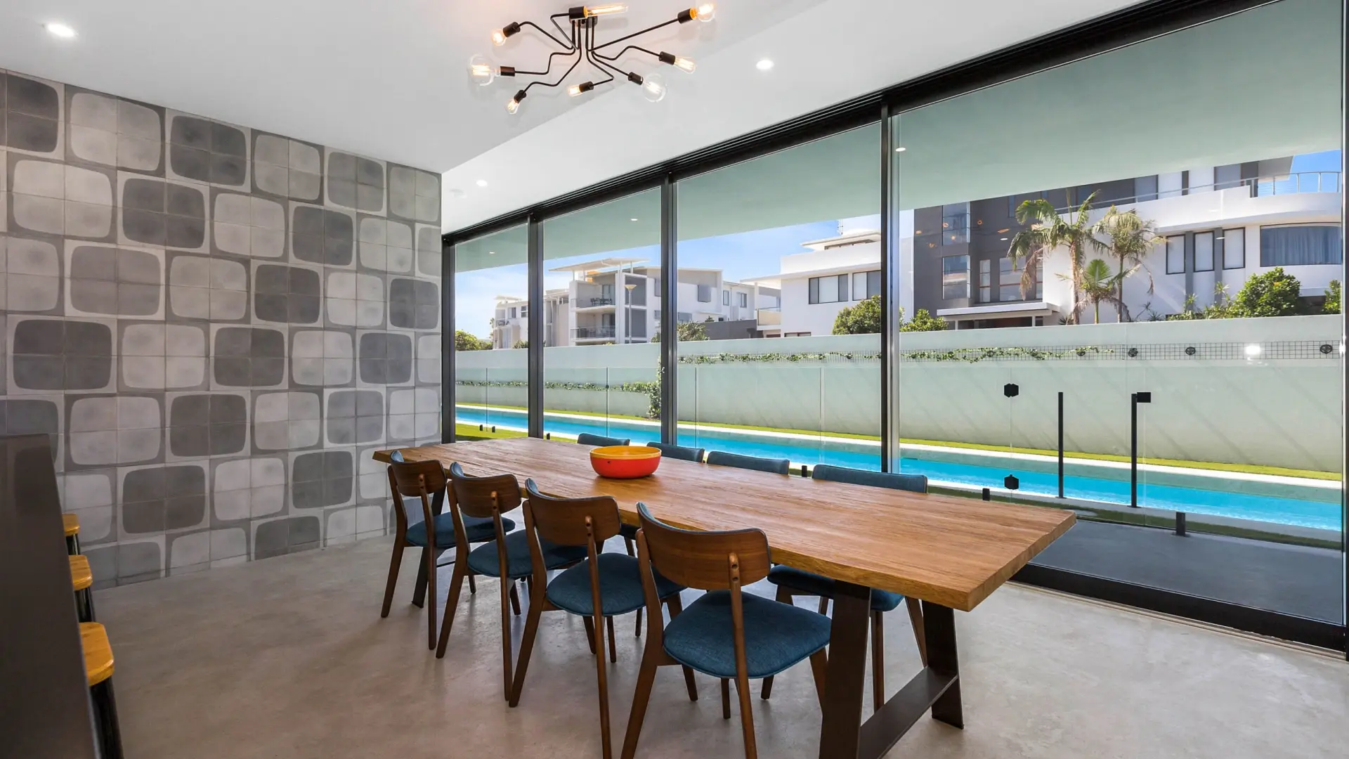 Aluminium sliding doors and glazing in a modern Ballina home overlooking the pool