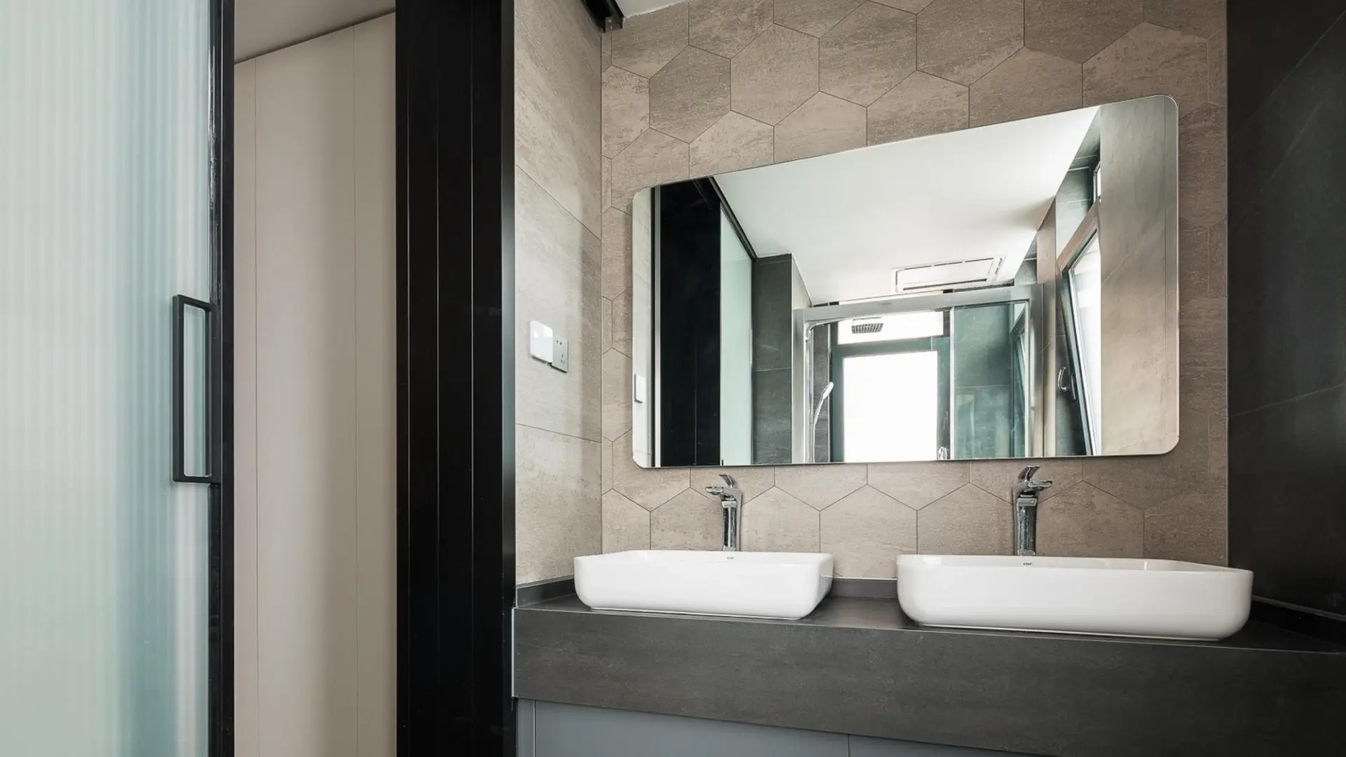Custom-cut mirror reflecting natural light in a stylish Ballina bathroom