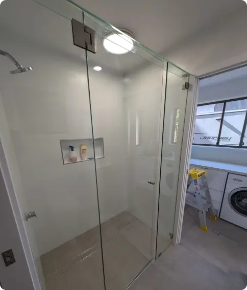 Frameless glass shower screen in a modern bathroom