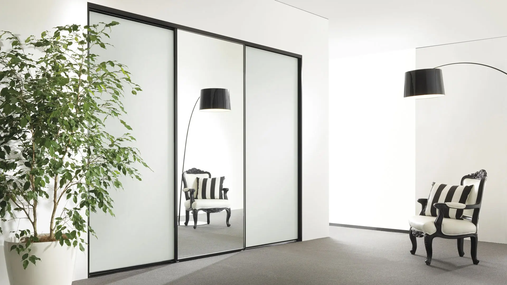 Custom sliding wardrobe doors in a modern Ballina bedroom, built by Alumalite