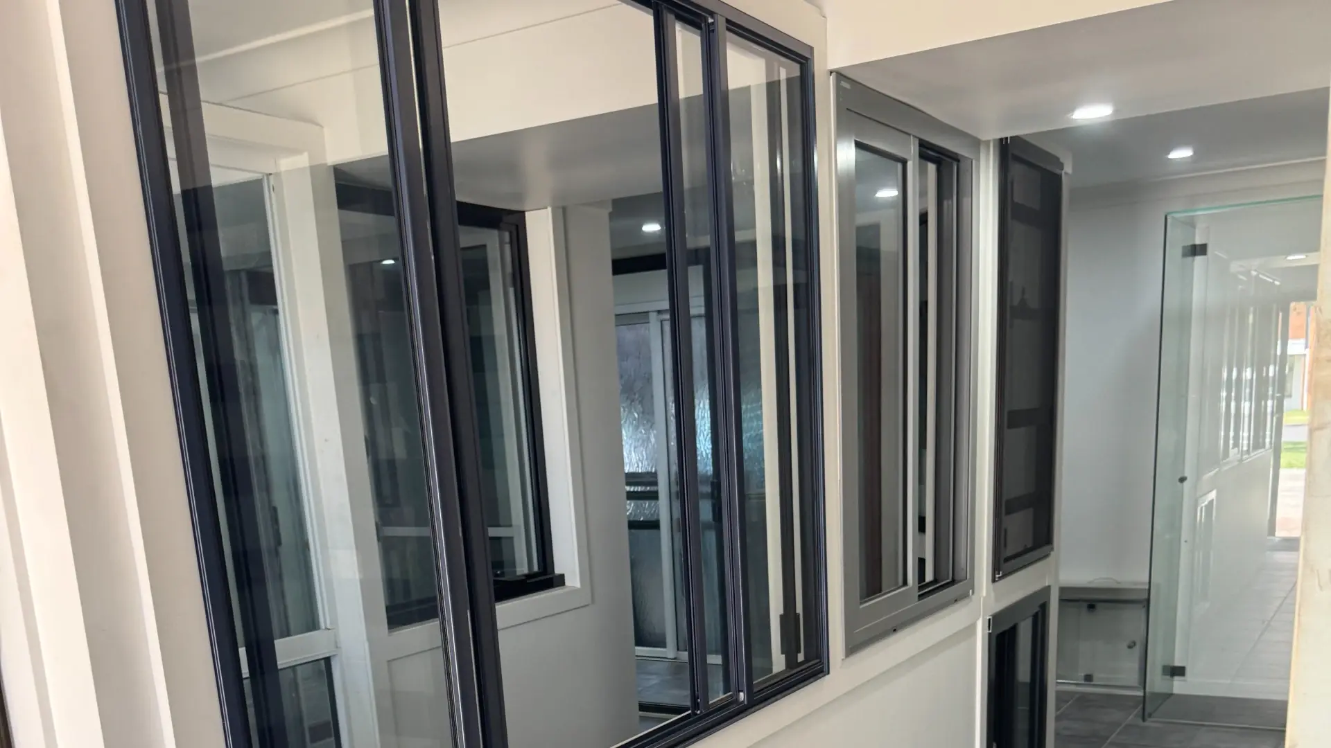 Custom aluminium windows framing the view from a modern Northern Rivers home