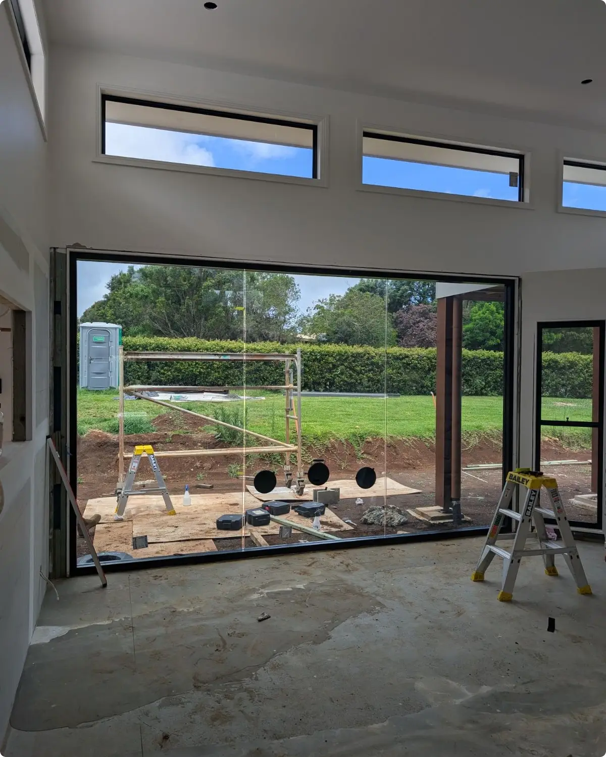 Tall custom aluminium windows letting natural light into a Ballina home