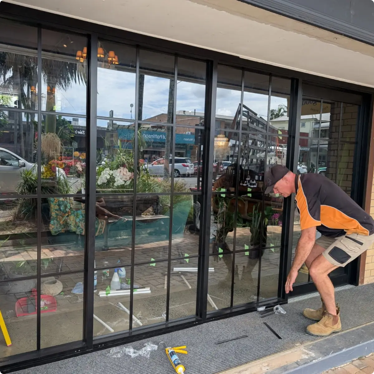 Aluminium stacker doors custom made by Alumalite connecting a living space to a Northern Rivers deck