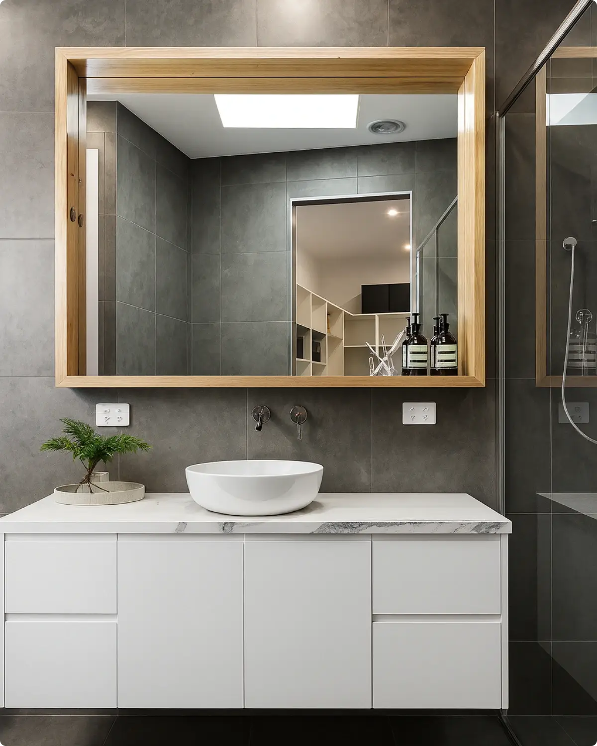 Custom mirror cut to size above a vanity in a Ballina bathroom