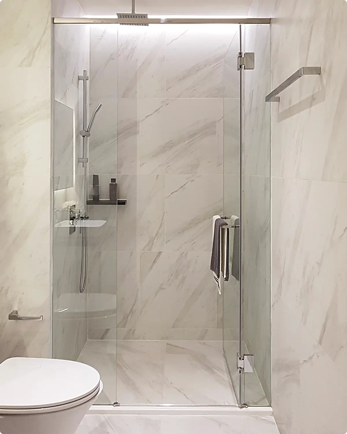Frameless glass shower screen with polished fittings in a Northern Rivers bathroom