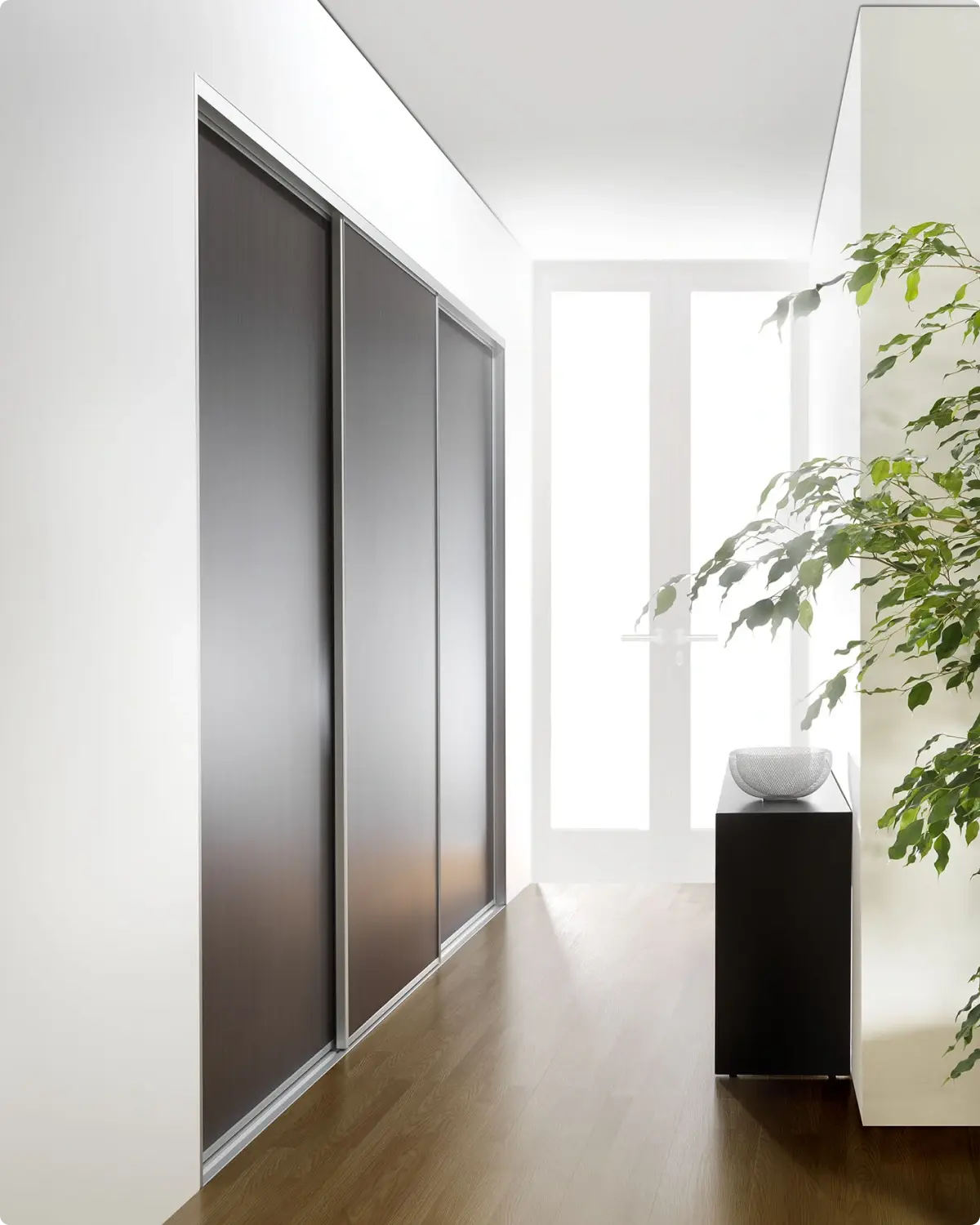 Custom panel-finish sliding wardrobe doors made to measure in Alumalite's Ballina factory